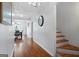 Long hallway with hardwood floors and access to dining area at 6051 Reynolds Rd, Morrow, GA 30260