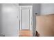 Simple hallway with hardwood floors and a closet at 6051 Reynolds Rd, Morrow, GA 30260