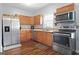 Kitchen features stainless steel appliances and wood flooring at 6051 Reynolds Rd, Morrow, GA 30260
