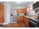 Stainless steel appliances and wood floors in this kitchen at 6051 Reynolds Rd, Morrow, GA 30260