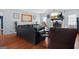 Spacious living room with a fireplace and hardwood floors at 6051 Reynolds Rd, Morrow, GA 30260