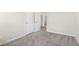 Bright bedroom with neutral carpeting, white trim, and dual closets at 205 Friendship Oak Way, Hampton, GA 30228