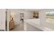 Upstairs hallway with view to office space, natural light, and neutral walls at 205 Friendship Oak Way, Hampton, GA 30228
