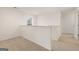 A view of a neutrally painted hallway with carpet flooring showcasing access to various rooms at 205 Friendship Oak Way, Hampton, GA 30228