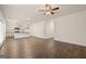 Open-concept living area with hardwood floors, recessed lighting, and kitchen access at 205 Friendship Oak Way, Hampton, GA 30228
