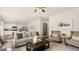 Spacious living room with neutral tones and ample seating for entertaining at 205 Friendship Oak Way, Hampton, GA 30228