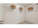 Walk-in closet featuring wire shelving and neutral carpet at 205 Friendship Oak Way, Hampton, GA 30228