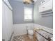 Simple bathroom with a toilet, shower, and white wainscoting at 165 Nandover Way, Fayetteville, GA 30215