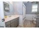 Bathroom with gray vanity, shower, and patterned flooring at 165 Nandover Way, Fayetteville, GA 30215