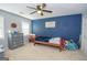 Blue-walled bedroom with a twin bed, dresser, and inspirational quote at 165 Nandover Way, Fayetteville, GA 30215
