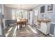 Bright dining room with bay window and wooden table, offering a sunny space at 165 Nandover Way, Fayetteville, GA 30215