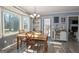 Charming dining area with a wooden table and chairs, and a bay window at 165 Nandover Way, Fayetteville, GA 30215