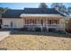House exterior with front porch and landscaping at 165 Nandover Way, Fayetteville, GA 30215