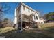 Two story home showcasing deck and backyard at 165 Nandover Way, Fayetteville, GA 30215