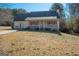 House front view with yard and driveway at 165 Nandover Way, Fayetteville, GA 30215