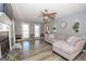 Bright living room with hardwood floors, fireplace and a comfortable sectional sofa at 165 Nandover Way, Fayetteville, GA 30215