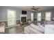 Living room boasts hardwood floors, fireplace, and ample natural light at 165 Nandover Way, Fayetteville, GA 30215