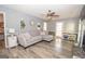 Spacious living room featuring a neutral color palette, L-shaped sofa, and fireplace at 165 Nandover Way, Fayetteville, GA 30215