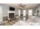 Living room with hardwood floors, fireplace, and large windows for natural light at 165 Nandover Way, Fayetteville, GA 30215