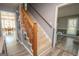 Wooden staircase with view of dining area at 165 Nandover Way, Fayetteville, GA 30215