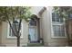 Front entrance of a two story house with white door and arched windows at 190 Oakwood Lakes Dr, Hampton, GA 30228