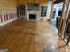 Large living room with hardwood floors and fireplace at 190 Oakwood Lakes Dr, Hampton, GA 30228