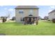 Backyard with gazebo, patio furniture, and grassy area at 2171 Grant Ave, Mcdonough, GA 30252