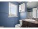 Bathroom with dark vanity, white sink and toilet at 2171 Grant Ave, Mcdonough, GA 30252