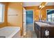 Bathroom with double vanity, tub, and access to bedroom at 2171 Grant Ave, Mcdonough, GA 30252