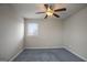 Neutral-toned bedroom with ceiling fan and carpet at 2171 Grant Ave, Mcdonough, GA 30252