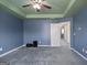 Blue bedroom with carpet and ceiling fan at 2171 Grant Ave, Mcdonough, GA 30252