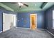 Spacious bedroom with ceiling fan and carpet at 2171 Grant Ave, Mcdonough, GA 30252