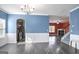 Bright dining room with hardwood floors and view into kitchen at 2171 Grant Ave, Mcdonough, GA 30252