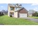 Two-story brick home with attached garage and landscaped lawn at 2171 Grant Ave, Mcdonough, GA 30252