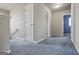 Upstairs hallway with carpet and neutral paint colors at 2171 Grant Ave, Mcdonough, GA 30252