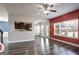 Living room with fireplace, hardwood floors, and access to kitchen at 2171 Grant Ave, Mcdonough, GA 30252