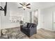 Open living area with gray couch, view of kitchen, and hardwood floors at 295 Cobalt Dr, Fayetteville, GA 30214