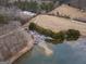 Scenic aerial view captures the property's lake and surrounding woodlands, offering privacy and natural beauty at 3505 Gum Creek Rd, Oxford, GA 30054