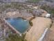 Overhead view capturing the serene pond and surrounding landscape of the property at 3505 Gum Creek Rd, Oxford, GA 30054