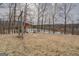 Lovely backyard featuring a charming swing and seating area overlooking a peaceful pond at 3505 Gum Creek Rd, Oxford, GA 30054