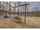 Backyard featuring a swing near a peaceful lake, ideal for relaxing outdoors at 3505 Gum Creek Rd, Oxford, GA 30054