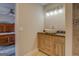 Bathroom featuring a vanity with a countertop sink, tile floors, and modern lighting at 3505 Gum Creek Rd, Oxford, GA 30054
