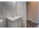 Bathroom featuring a vanity and door leading to a closet space at 3505 Gum Creek Rd, Oxford, GA 30054