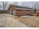 Brick home with a two-car garage, deck, and ample parking space near a tranquil lake at 3505 Gum Creek Rd, Oxford, GA 30054