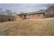 Brick house featuring a covered porch and inviting outdoor space on a sprawling lot at 3505 Gum Creek Rd, Oxford, GA 30054