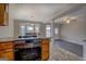 Kitchen with stainless steel oven and view to dining room with a bay window providing natural light at 3505 Gum Creek Rd, Oxford, GA 30054
