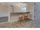 Eat-in kitchen features a bar with seating, decorative tile flooring, and a view into the adjacent rooms at 3505 Gum Creek Rd, Oxford, GA 30054