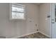 Laundry room with a window for natural light, and hookups for the washer and dryer at 3505 Gum Creek Rd, Oxford, GA 30054
