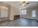 Bright living room featuring new floors, paint, windows and an elegant entertainment center at 3505 Gum Creek Rd, Oxford, GA 30054