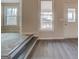 Open living room concept with steps leading up to an additional room and access to outdoors at 3505 Gum Creek Rd, Oxford, GA 30054